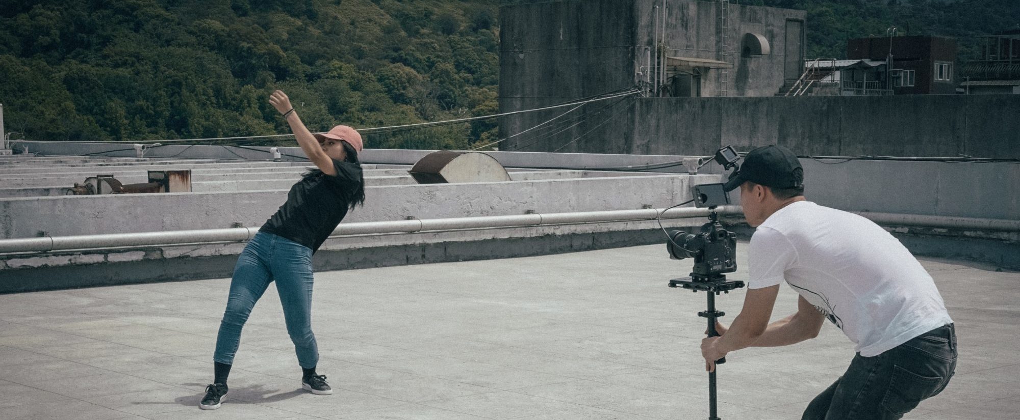 Photo image on Roof of videographer and female talent.